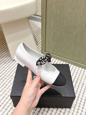 CHANEL 25S MARY JANES IN WHITE AND BLACK SHEARLING AND GROS GRAIN