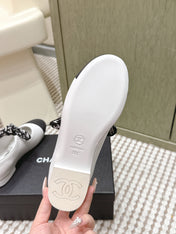 CHANEL 25S MARY JANES IN WHITE AND BLACK SHEARLING AND GROS GRAIN