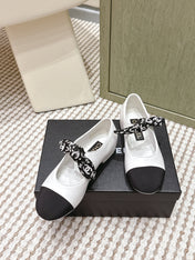 CHANEL 25S MARY JANES IN WHITE AND BLACK SHEARLING AND GROS GRAIN