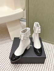 CHANEL 25S ANKLE BOOTS IN  WHITE CALFSKIN AND BLACK GLOSSY TOE RUCHED