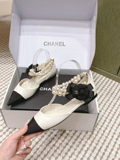 CHANEL 25S ESPADRILLE FLATS IN WHITE AND BLACK CALFSKIN WITH PEARL STRAP