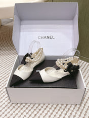 CHANEL 25S ESPADRILLE FLATS IN WHITE AND BLACK CALFSKIN WITH PEARL STRAP