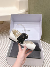 CHANEL 25S ESPADRILLE FLATS IN WHITE AND BLACK CALFSKIN WITH PEARL STRAP