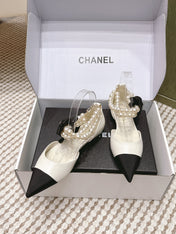 CHANEL 25S ESPADRILLE FLATS IN WHITE AND BLACK CALFSKIN WITH PEARL STRAP