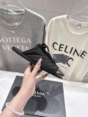PRADA 25S MULES IN BLACK WITH METAL TOECAP