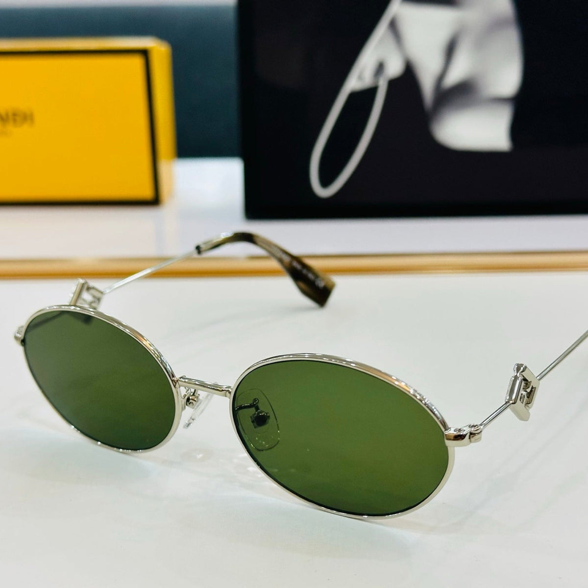 FIRST CRYSTAL OVAL FRAME SUNGLASSES E40151 IN METAL