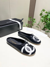 CHANEL 26S FLAT MULES IN BLACK LAMBSKIN