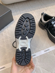 CHANEL 25S TRAINERS 40MM IN BLACK AND WHITE CALFSKIN AND SUEDE