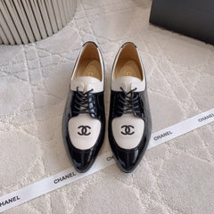 CHANEL 25S TWO TONE LACE UP IN BLACK AND WHITE SHINY CALFSKIN