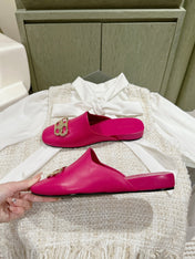 FLAT MULES IN DEEP PINK SMOOTH CALFSKIN GOLD BUCKLE
