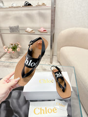 THONG SANDALS IN BLACK CALFSKIN AND CANVAS