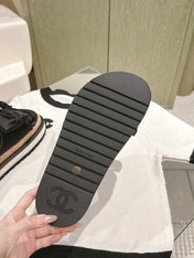 CC SLIPPERS WITH SILK BOW IN BLACK COWHIDE