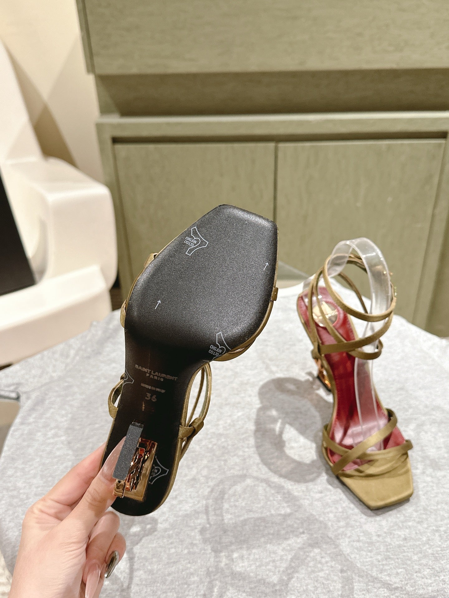 YSL 25S HIGH-HEEL SANDALS 100 MM IN MOSS GREEN SATIN WITH YSL LOGO HEEL DESIGN IN GOLD