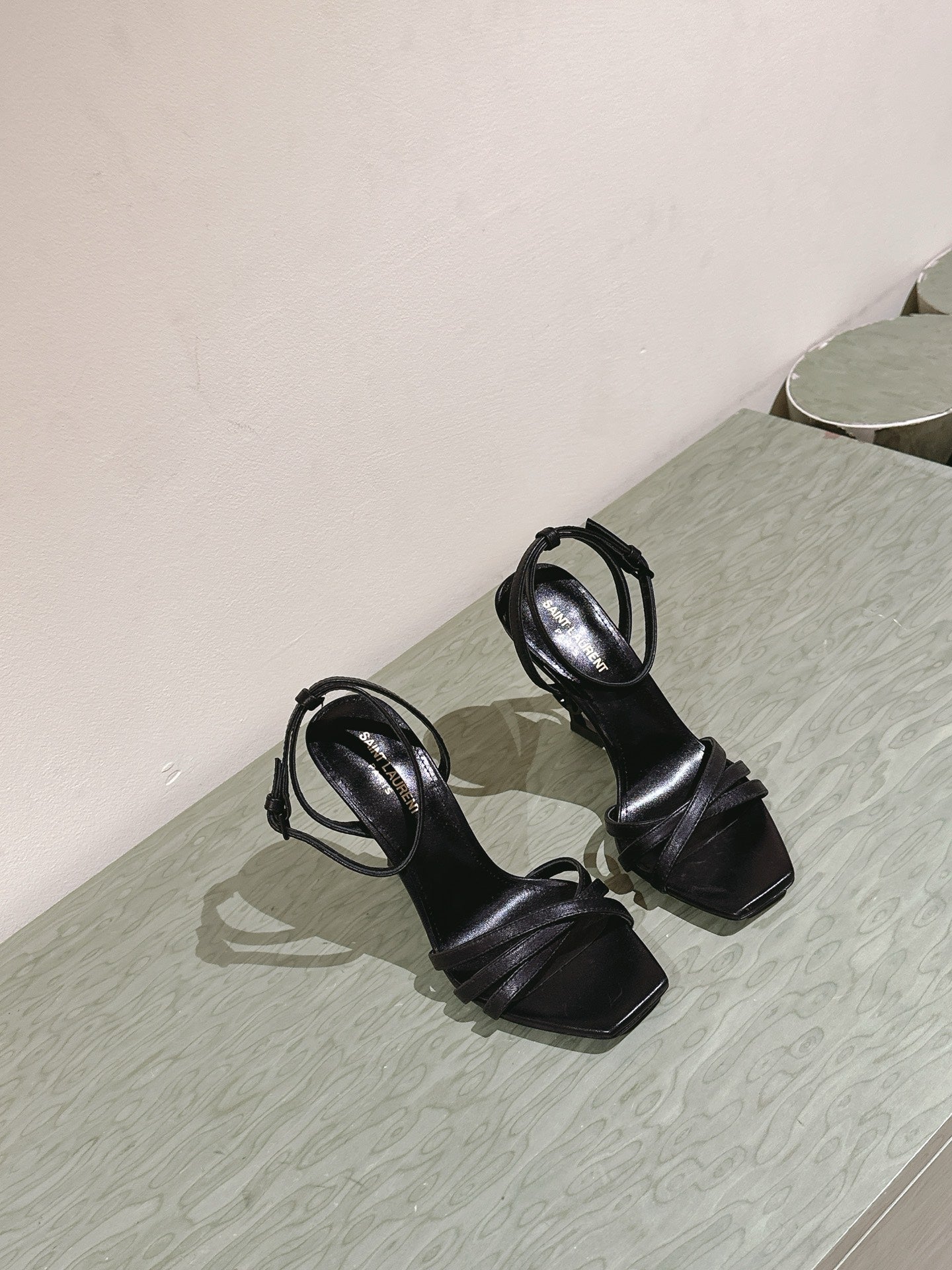 YSL 25S HIGH-HEEL SANDALS 100 MM IN BLACK LAMBSKIN WITH YSL LOGO HEEL DESIGN