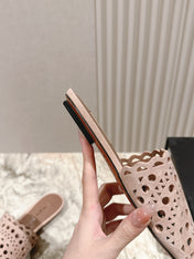 ALAIA PERFORATED SLIDE SANDALS 25S IN PINK BEIGE SUEDE