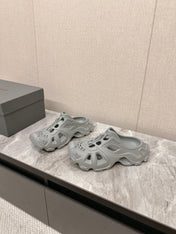 CUT-OUT MULES IN GRAY RUBBER