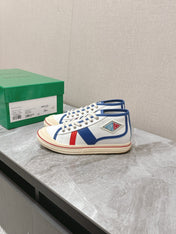 ELIOT SNEAKER IN WHITE CANVAS WITH NAVY BLUE CALFSKIN