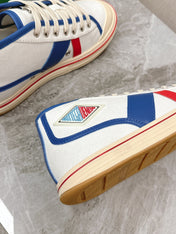 ELIOT SNEAKER IN WHITE CANVAS WITH NAVY BLUE CALFSKIN