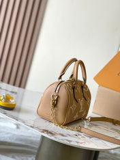 SPEEDY BANDOULIÈRE 20 IN MILK TEA MONOGRAM EMPREINTE LEATHER