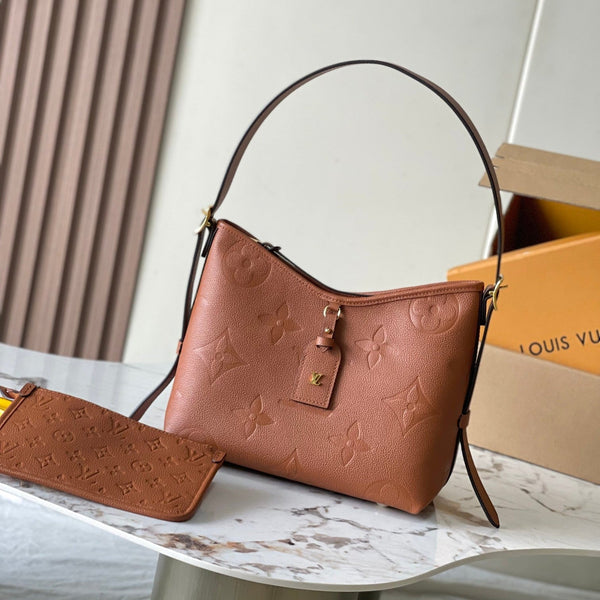 CARRYALL PM 29 IN COGNAC MONOGRAM EMPREINTE LEATHER GOLD LOGO