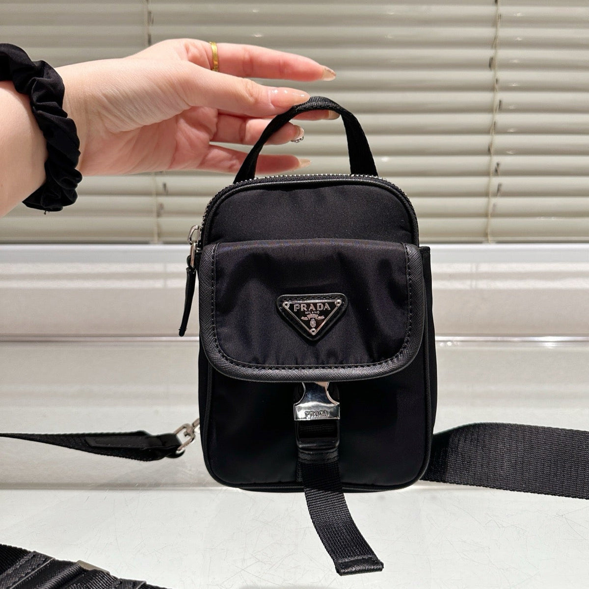 TRIANGLE LOGO MINI POUCH 17 IN BLACK RE-NYLON