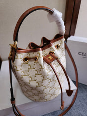 CLARA BAG 19 IN WHITE TRIOMPHE CANVAS AND BROWN CALFSKIN TRIM