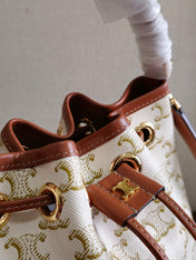 CLARA BAG 19 IN WHITE TRIOMPHE CANVAS AND BROWN CALFSKIN TRIM