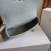 TEEN LOLA TRIOMPHE BAG 20 IN COOL GRAY BLUE CALFSKIN