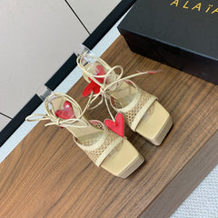 ALAIA BANQUET WEDGE SANDALS IN GOLD LAMBSKIN WITH RED HEART