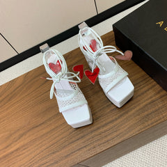 ALAIA BANQUET WEDGE SANDALS IN WHITE LAMBSKIN WITH RED HEART