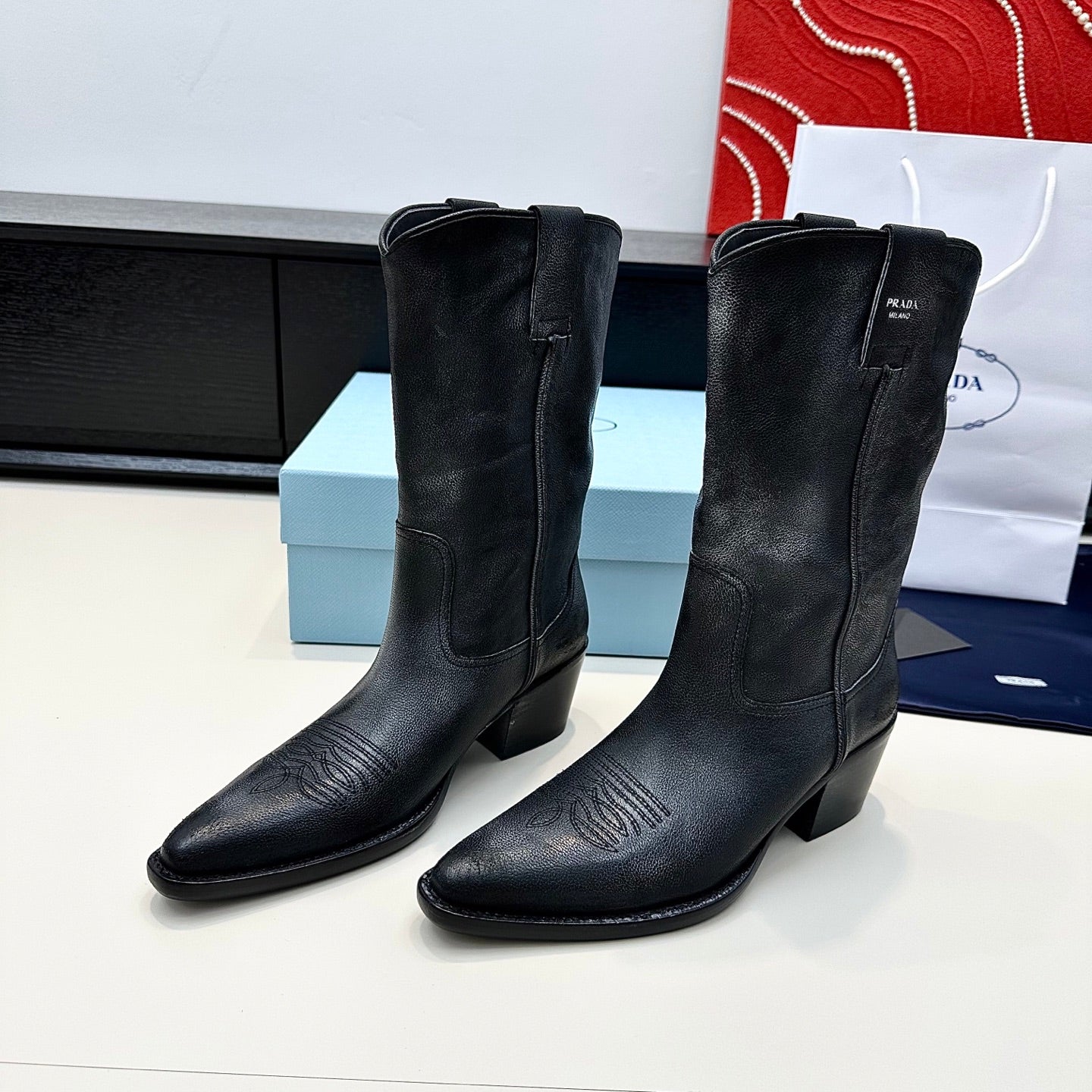 PRADA 25S POINTED-TOE LOW-CUT BOOTS IN BLACK COWHIDE