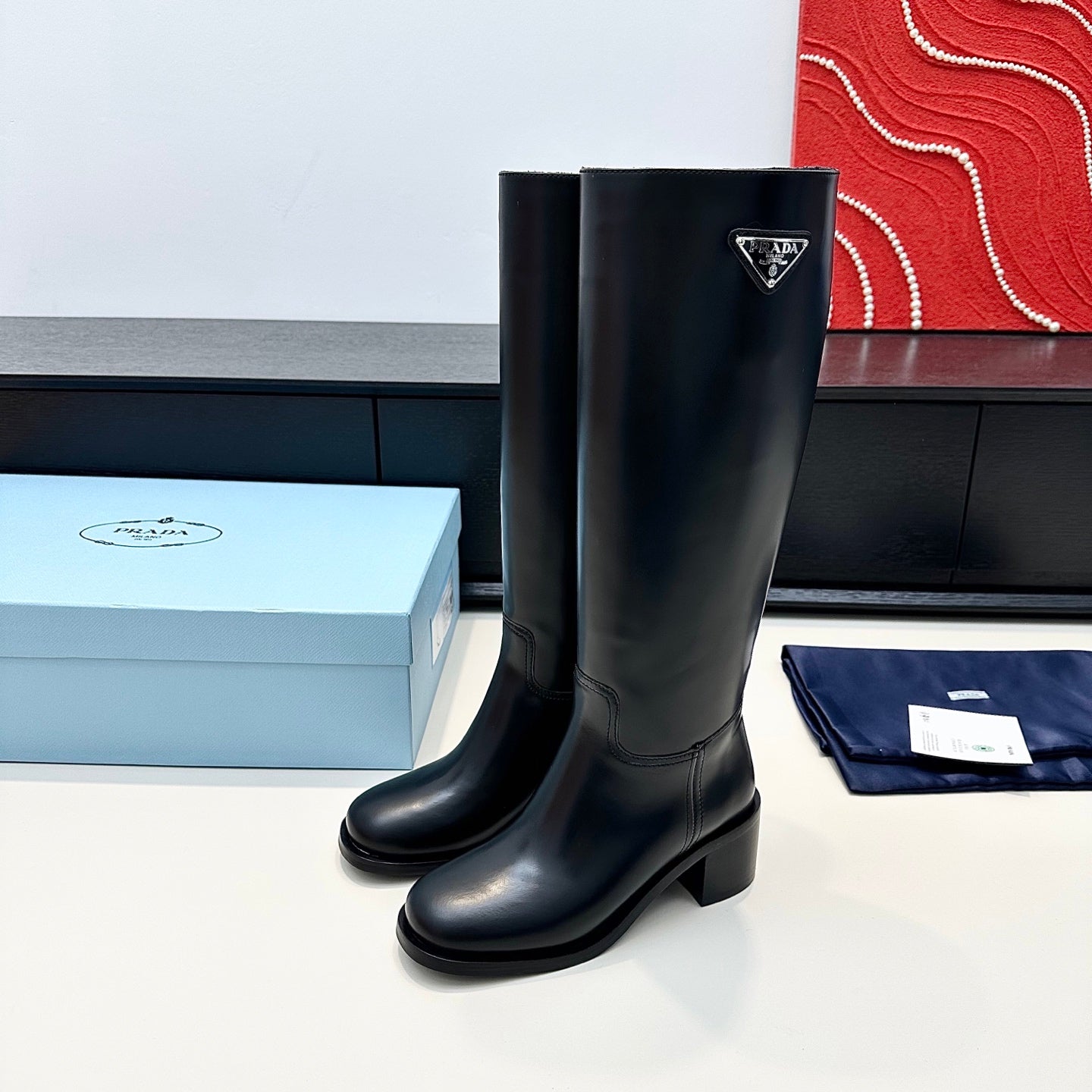 PRADA 25S HIGH-CUT BOOTS 55 MM IN BLACK CALFSKIN