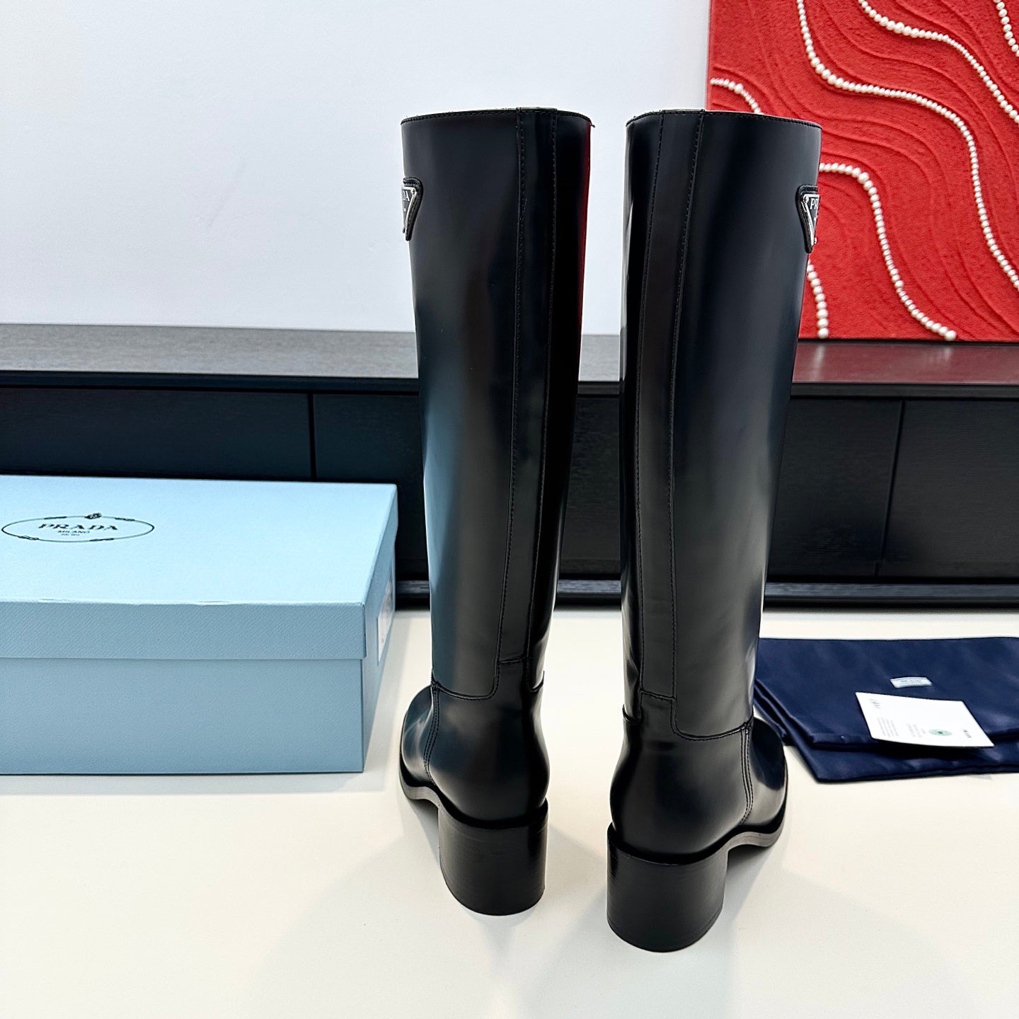 PRADA 25S HIGH-CUT BOOTS 55 MM IN BLACK CALFSKIN