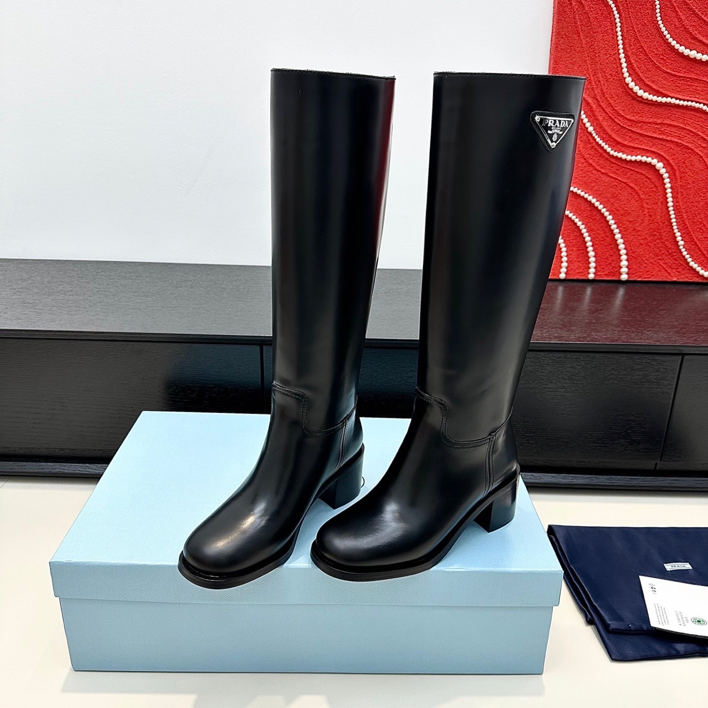 PRADA 25S HIGH-CUT BOOTS 55 MM IN BLACK CALFSKIN