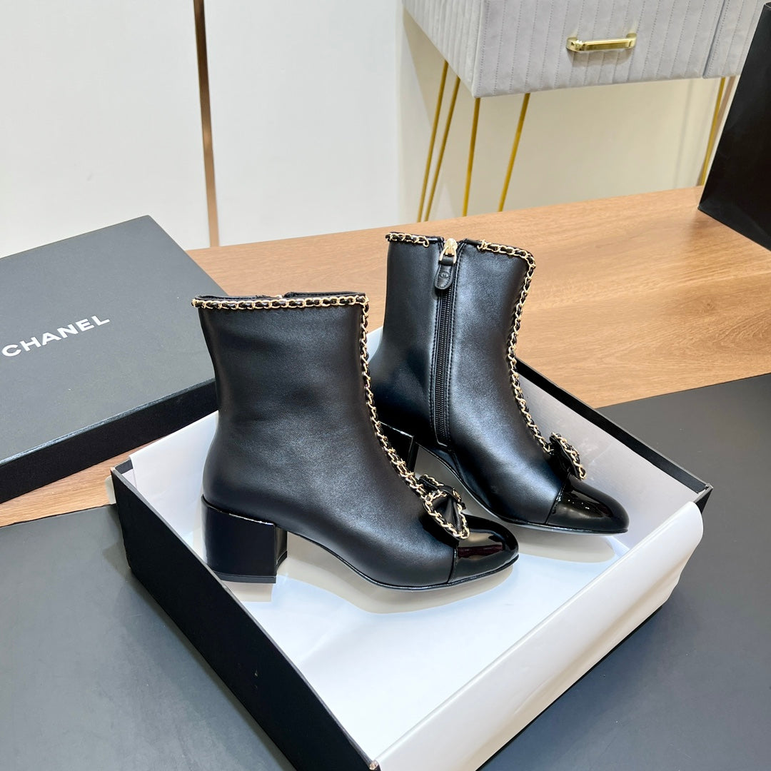 CHANEL 25S HEELED CHAIN BOOTS WITH BOW IN BLACK CALFSKIN GOLD HARDWRE