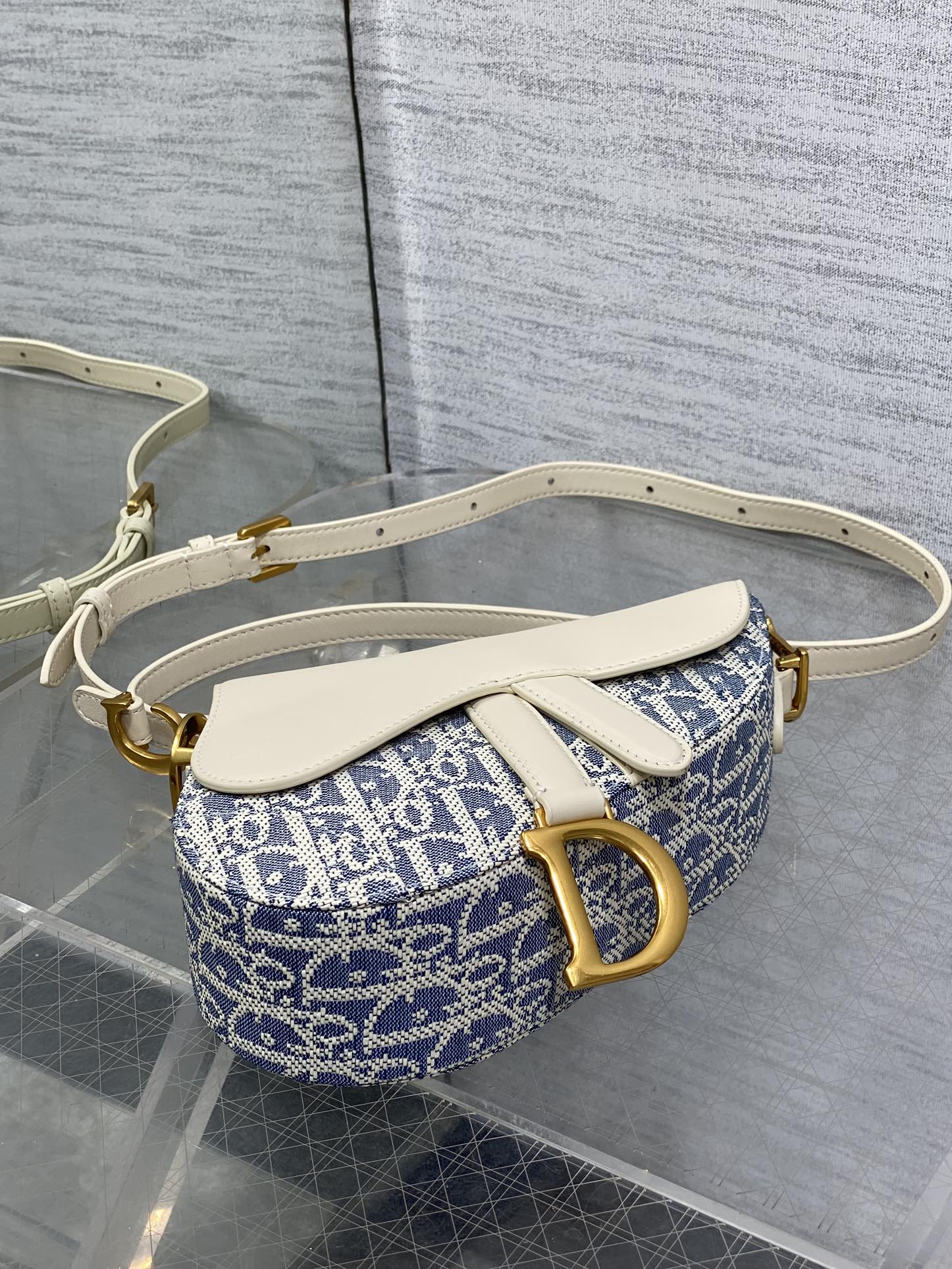 DIOR 25S MINI SOFT SADDLE BAG 19 IN BLUE DIOR OBLIQUE CHAMBRAY AND IVORY SMOOTH CALFSKIN