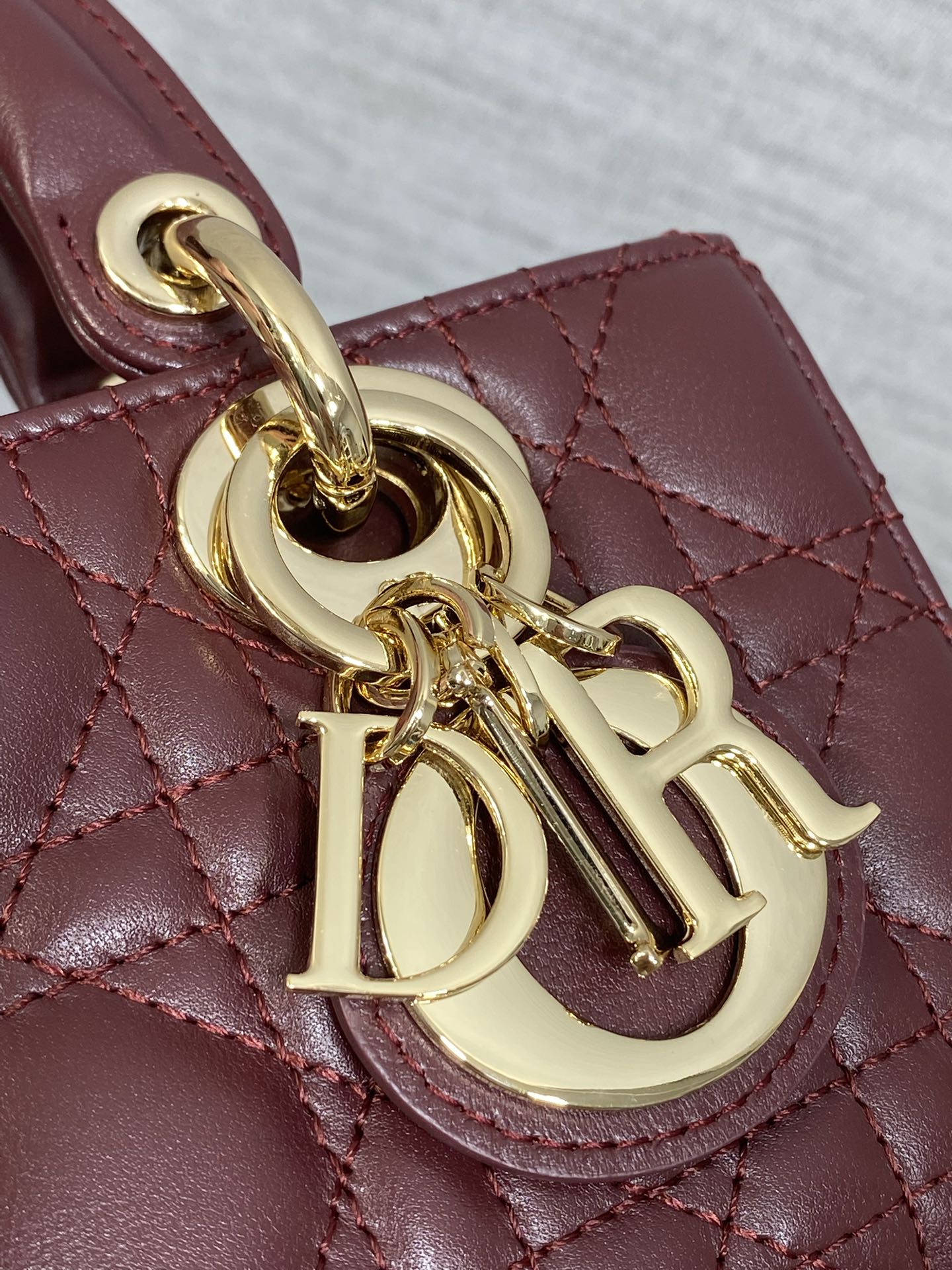 DIOR 25S SMALL LADY D‑JOY BAG 19 IN BURGUNDY CANNAGE CALFSKIN GOLD HARDWARE