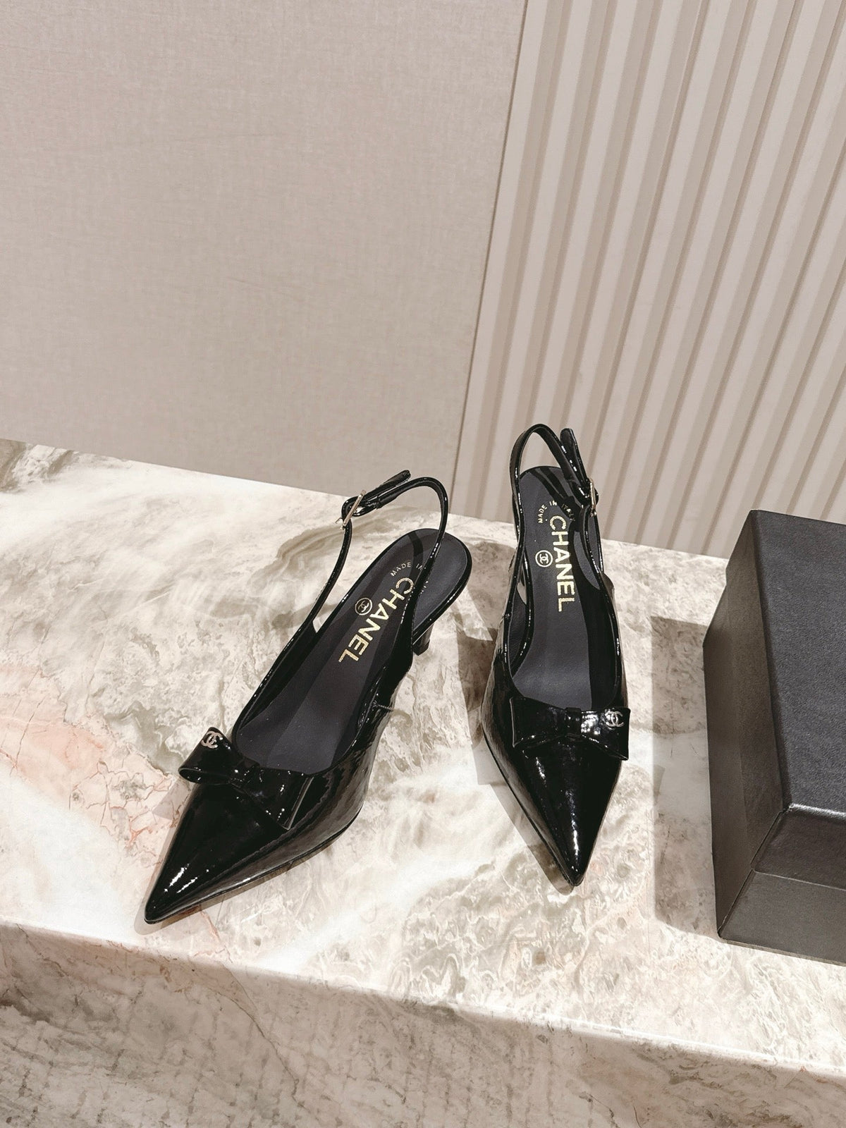 CC HIGH SLINGBACK IN BLACK LAMBSKIN WITH BOW ATTACHED