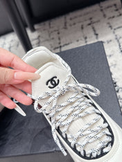 CHANEL 26S LACE-UP SNEAKERS IN WHITE FABRIC AND LAMBSKIN