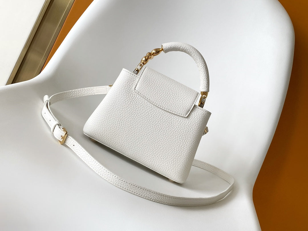 CAPUCINES EAST-WEST MINI 21 IN WHITE TAURILLON LEATHER GOLD-TONE HARDWARE