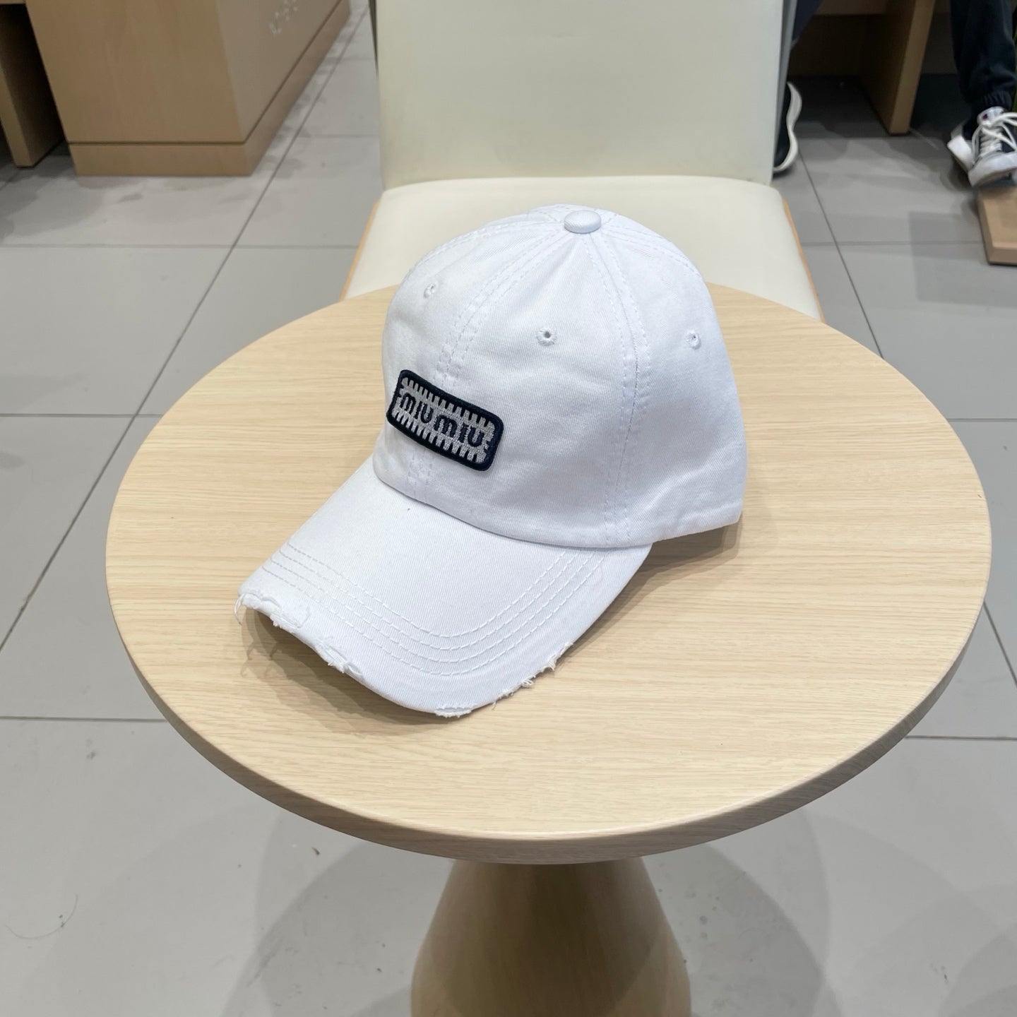 MM DISTRESSED FABRIC BASEBALL CAP IN WHITE WITH EMBROIDERED LOGO