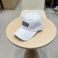 MM DISTRESSED FABRIC BASEBALL CAP IN WHITE WITH EMBROIDERED LOGO