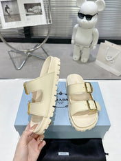 PRADA 25S STRAP SLIDES 30MM IN CREAM CALFSKIN GOLD HARDWARE