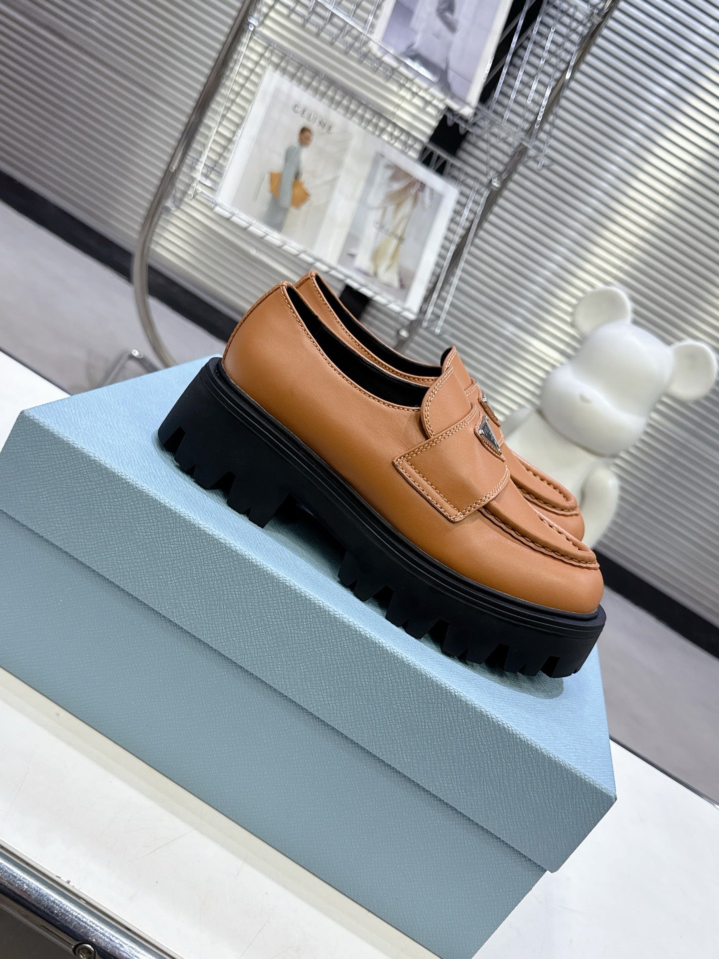 PRADA 25S THICK-SOLE LOAFERS 60 MM IN COGNAC BROWN CALFSKIN