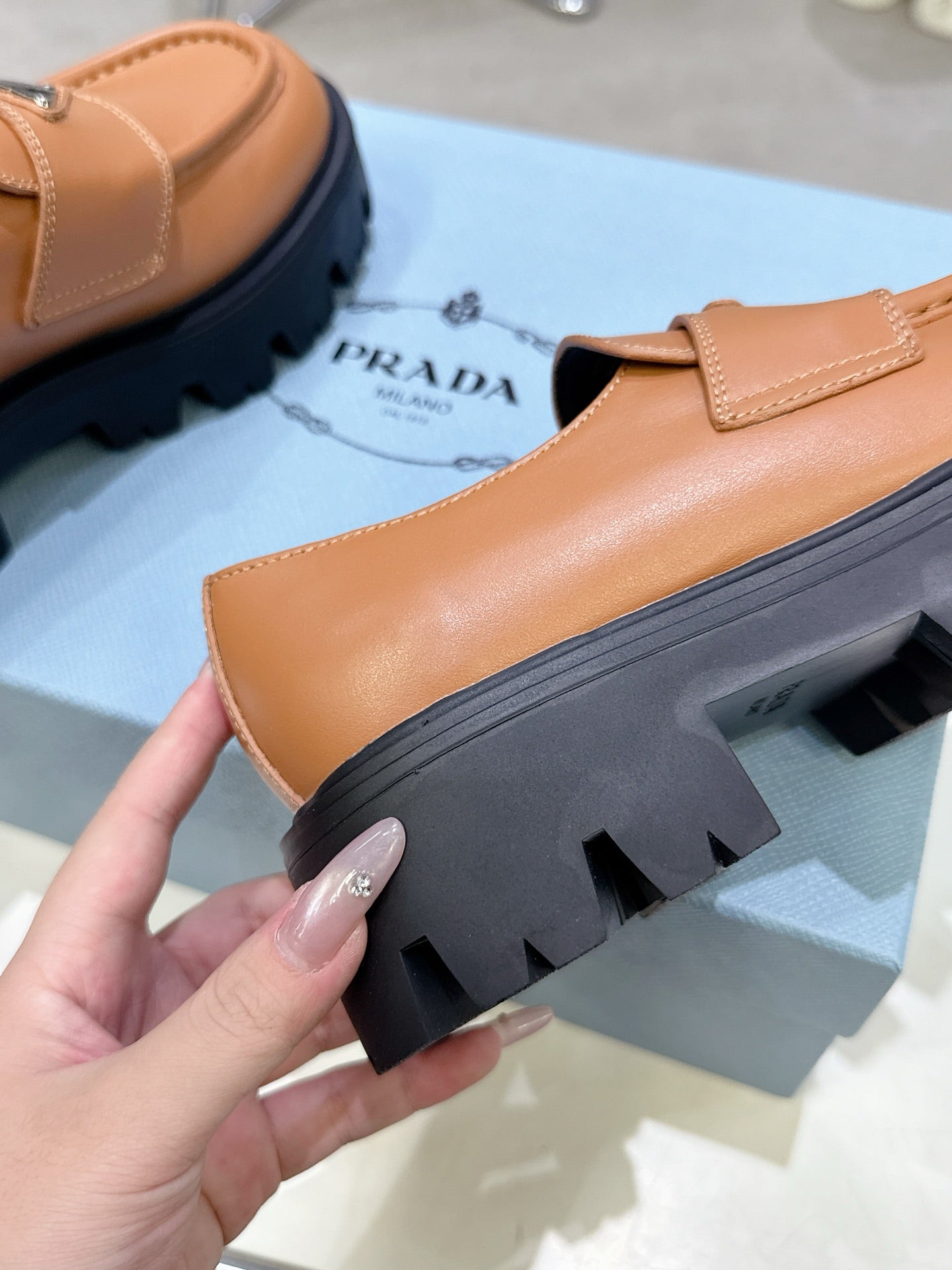 PRADA 25S THICK-SOLE LOAFERS 60 MM IN COGNAC BROWN CALFSKIN