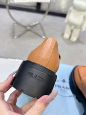 PRADA 25S THICK-SOLE LOAFERS 60 MM IN COGNAC BROWN CALFSKIN