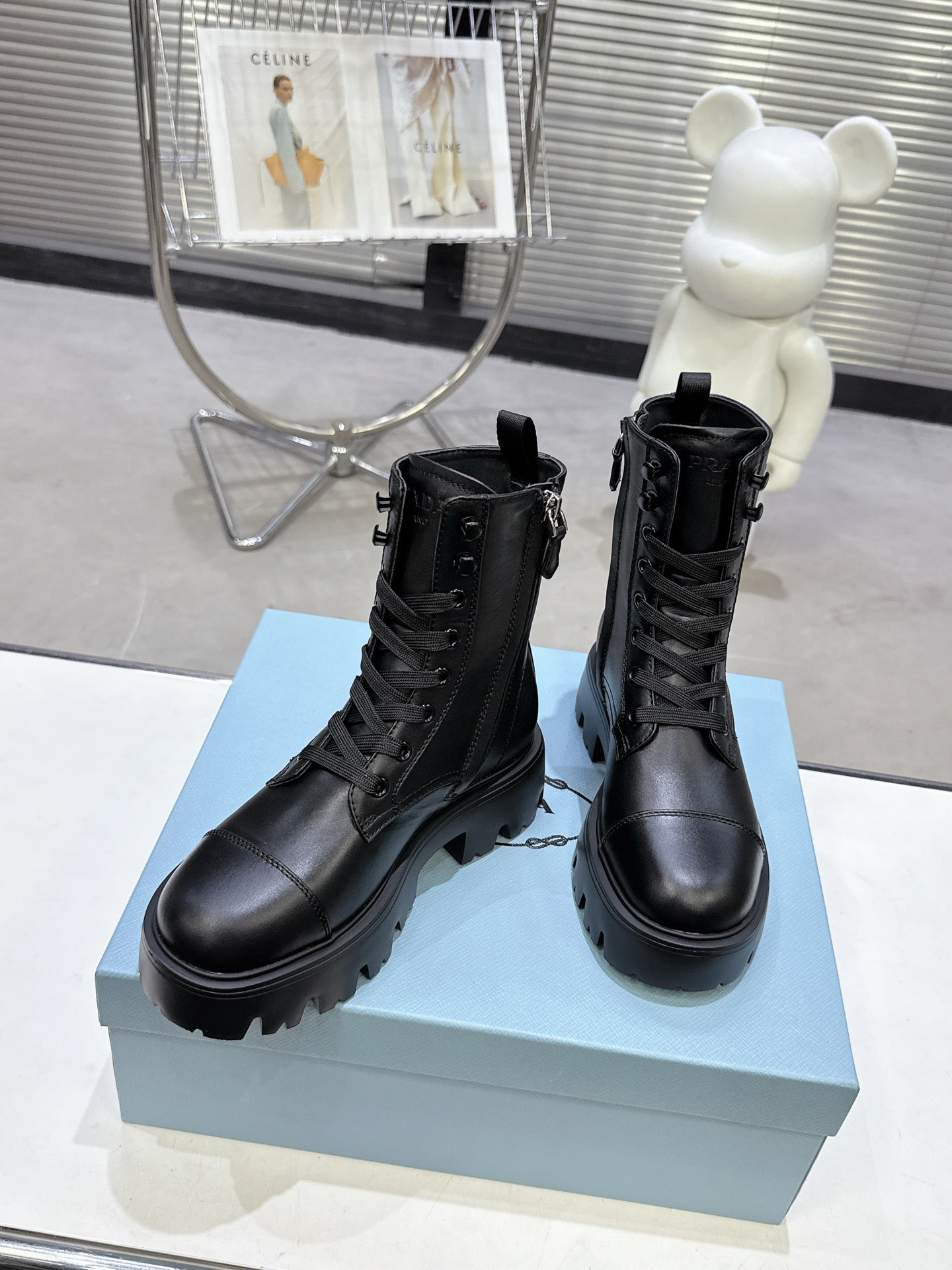 PRADA 25S WARRIOR BOOTS IN BLACK CALFSKIN