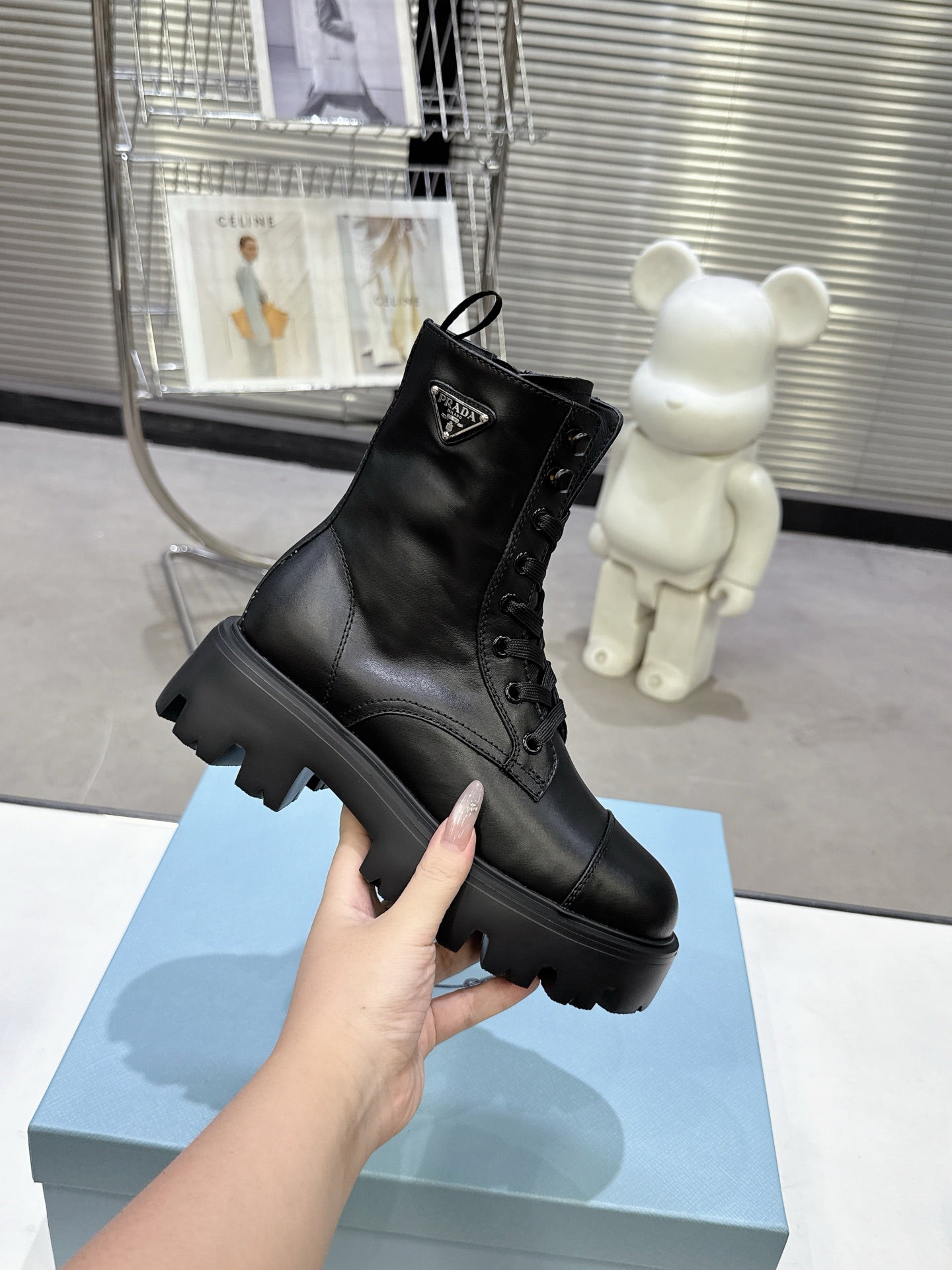 PRADA 25S WARRIOR BOOTS IN BLACK CALFSKIN
