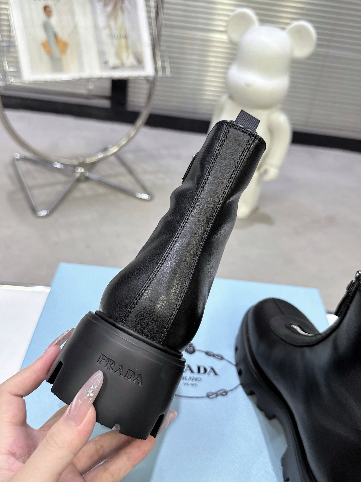 PRADA 25S ZIP-UP ANKLE BOOTS IN BLACK CALFSKIN