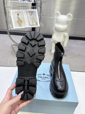 PRADA 25S ZIP-UP ANKLE BOOTS IN BLACK CALFSKIN